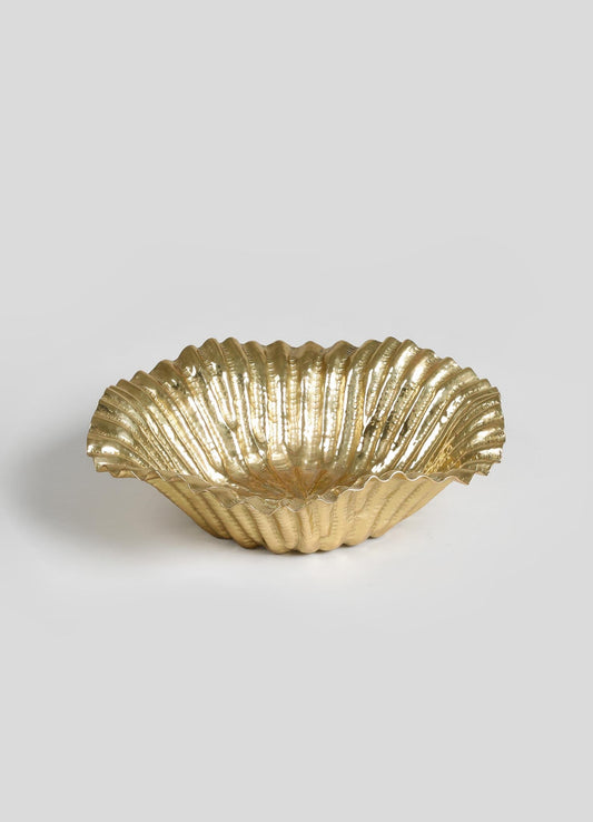 A metallic gold decorative bowl with a scalloped, ridged design, made of metal or ceramics, featuring a shell-like shape and polished finish.