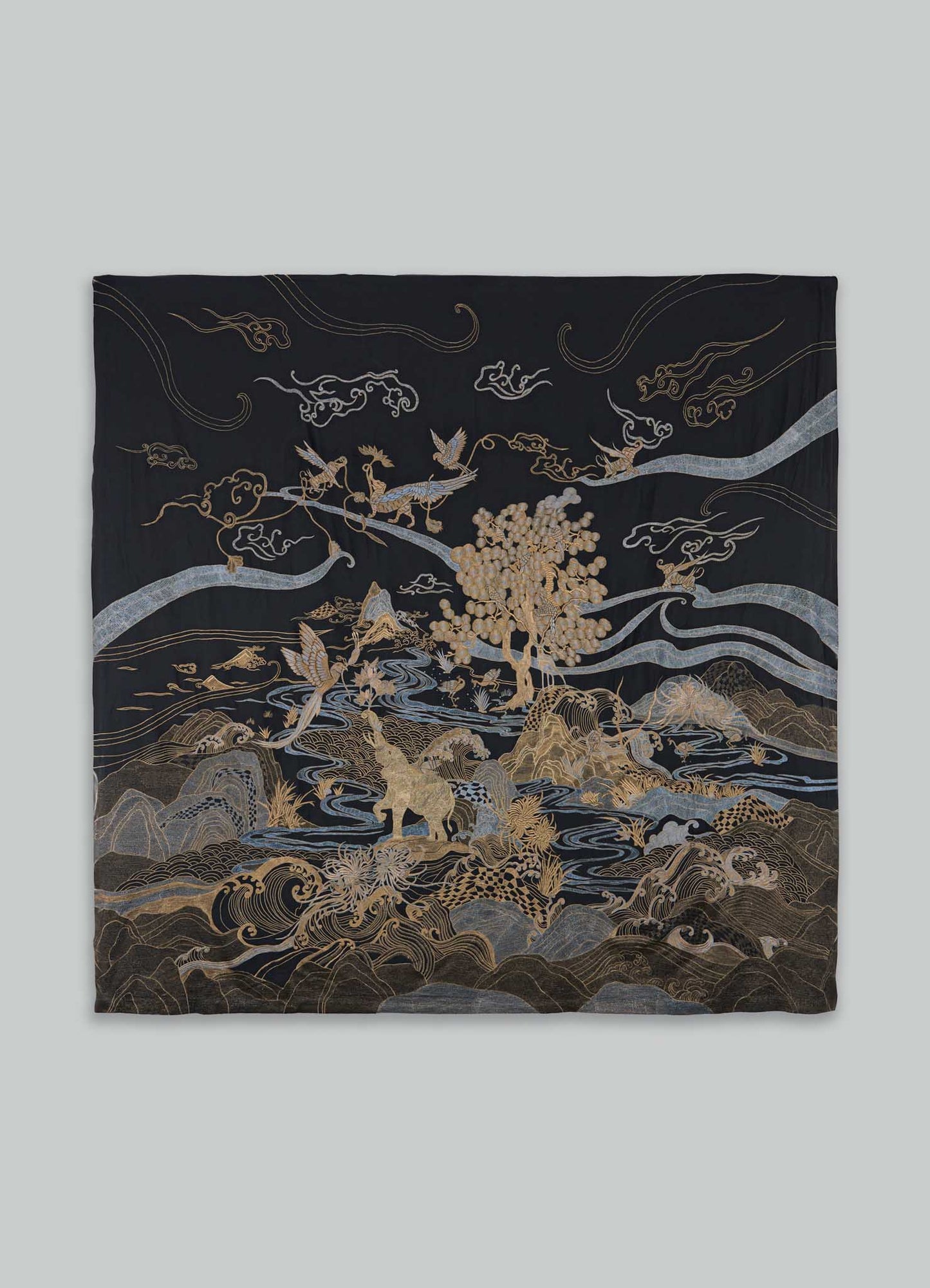 Embroidered fabric tapestry with intricate gold and silver floral and animal motifs on a black background, featuring a traditional Asian-inspired design.