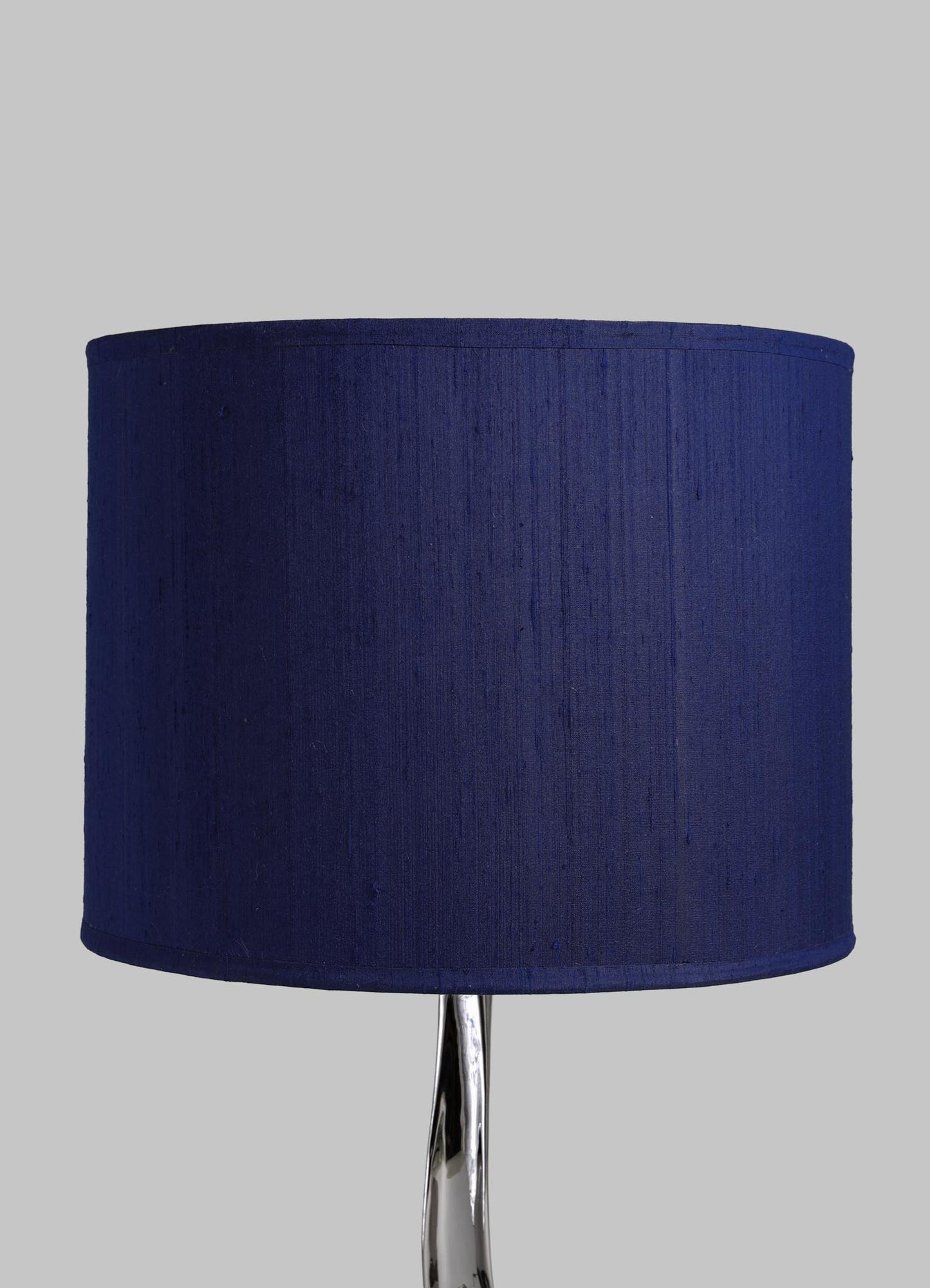 Navy blue lampshade on a gray background viya designer luxury table lamp