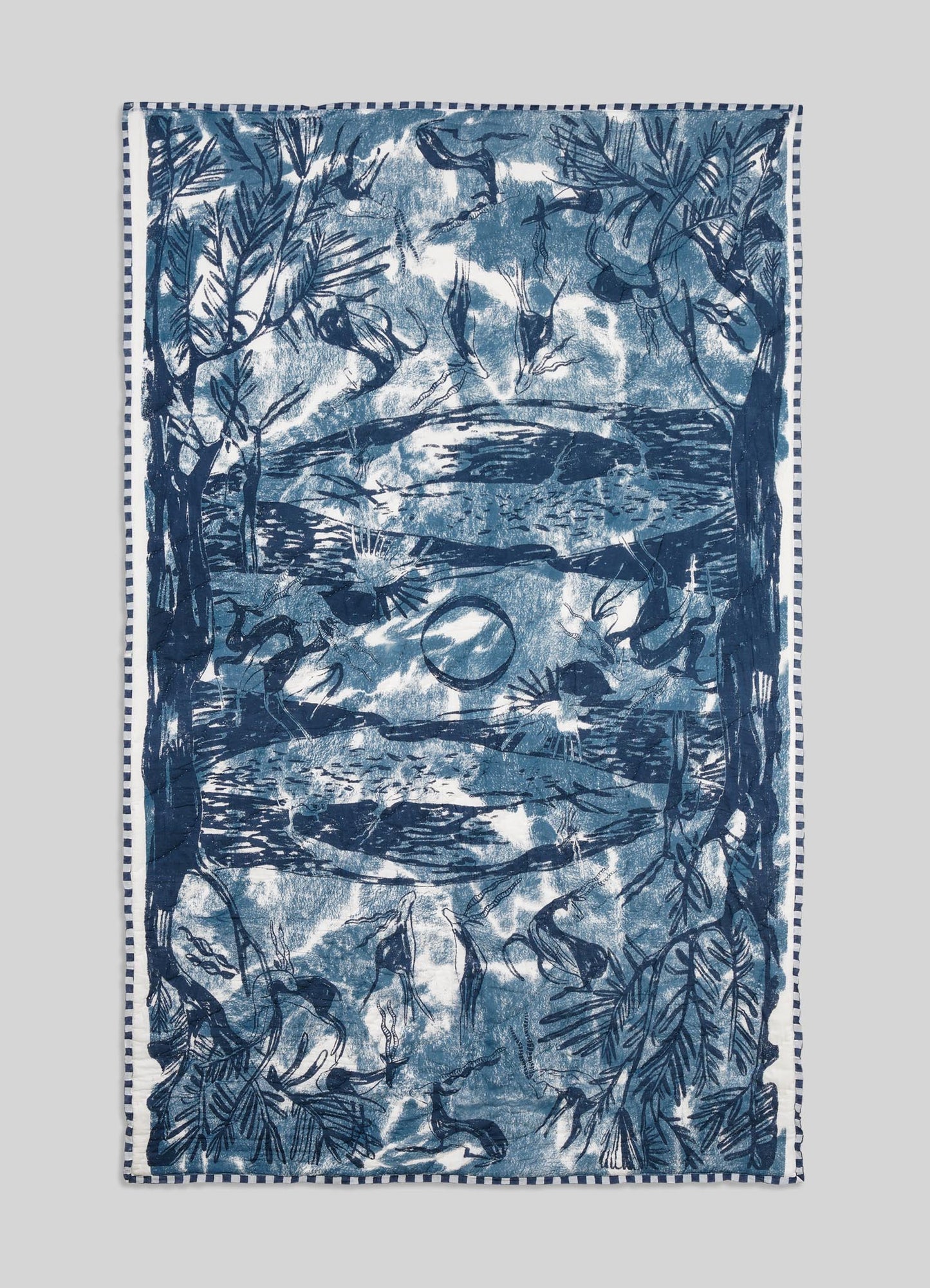 Blue and white patterned towel on a light gray background viya luxury cotton quilt