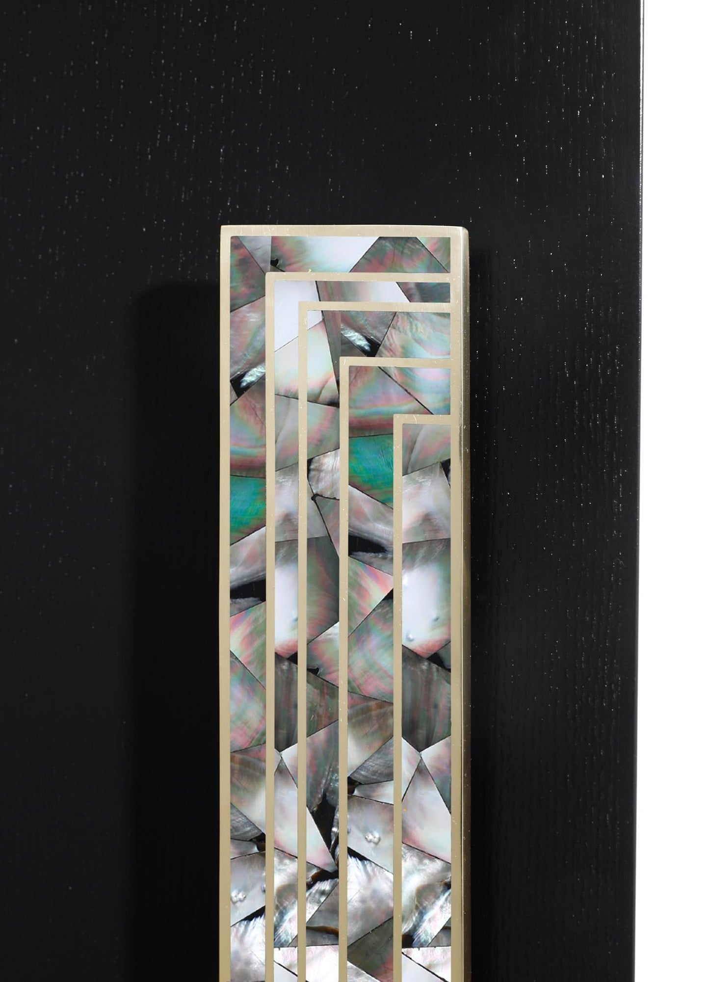 A decorative panel featuring a geometric metal frame with a gold finish and an abalone shell inlay, displaying iridescent, multi-colored, and organic patterns. The piece has a contemporary style with a focus on natural materials and reflective surfaces.