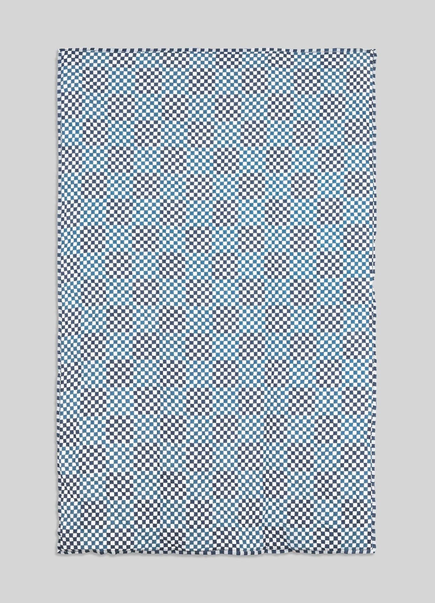 Checkered patterned fabric on a gray background viya luxury cotton quilt