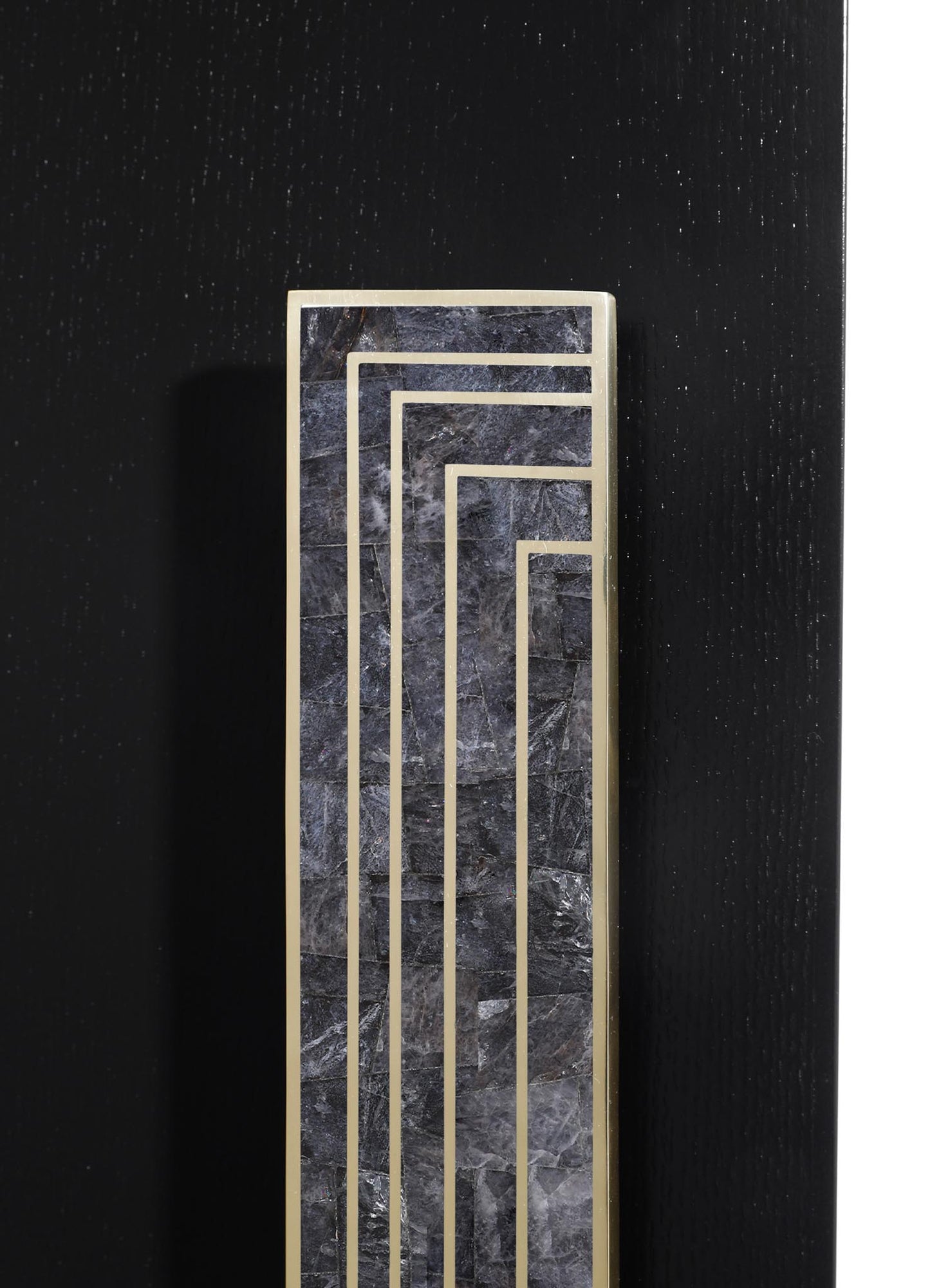 A decorative panel featuring a black marble surface with gray veining, accented by gold geometric lines. The design has a contemporary style with a sleek, polished finish.