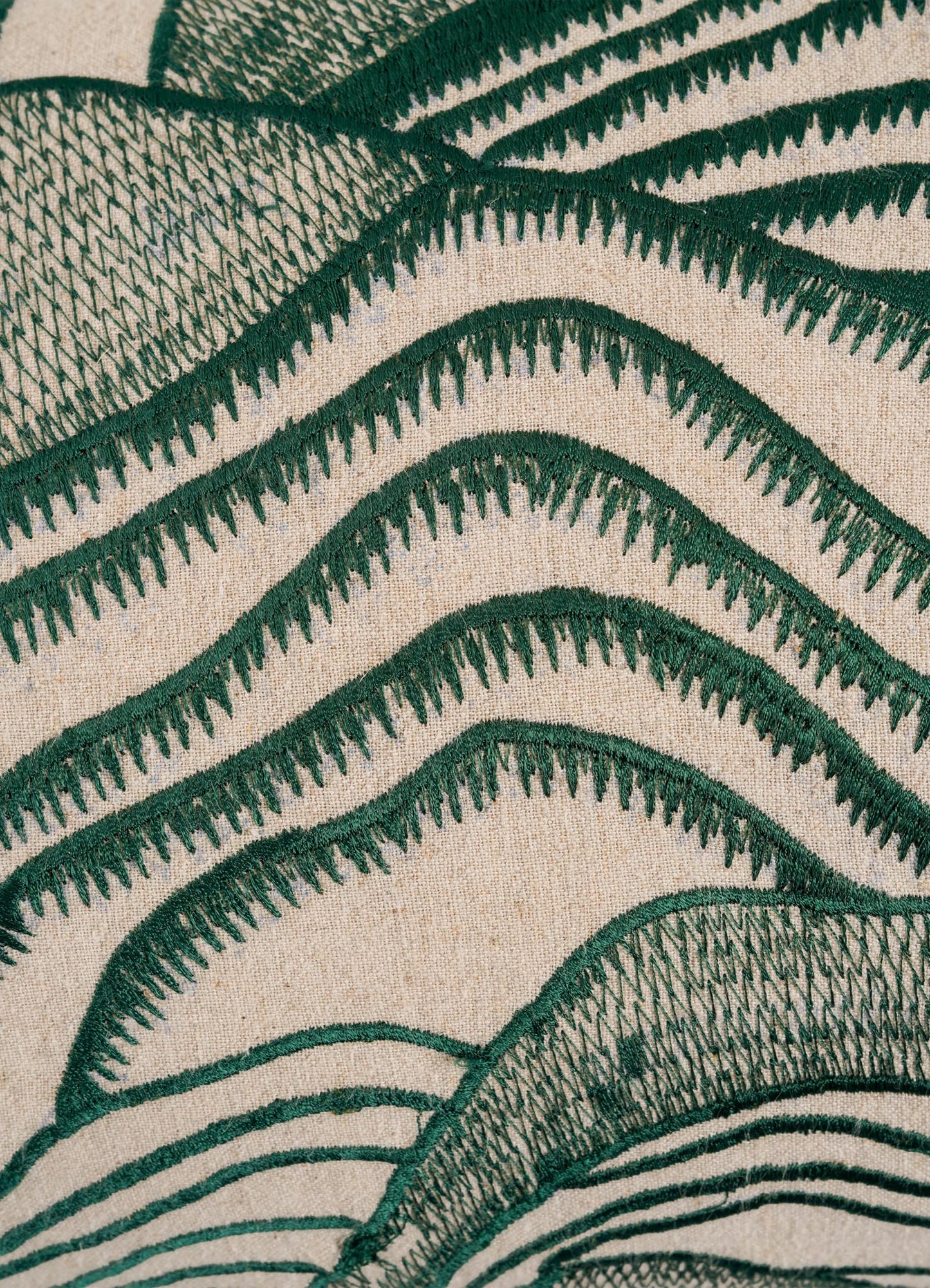 Close-up of the Viya Dreamscape Green Embroidered Mounds Cushion Cover (12"x18"), featuring textured green thread embroidery in wavy, abstract patterns on a beige base for an artistic, textile-inspired look.