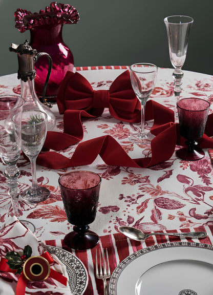 Create a celebratory atmosphere with Viya’s Orchard Red Table Cloth, evoking the vibrant hues of an Indian pomegranate. Pair with elegant plates and napkins for a festive table setting.