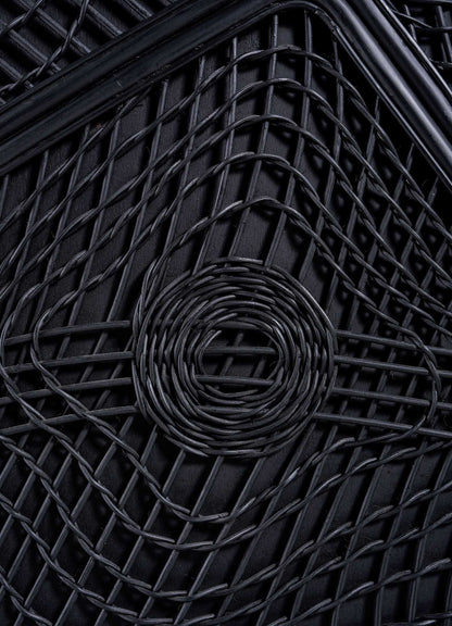 Close-up of the VIYA Chakra Cabinet showcases its black woven pattern with a central circular chakra-inspired design, intersecting lines, and thick black borders.