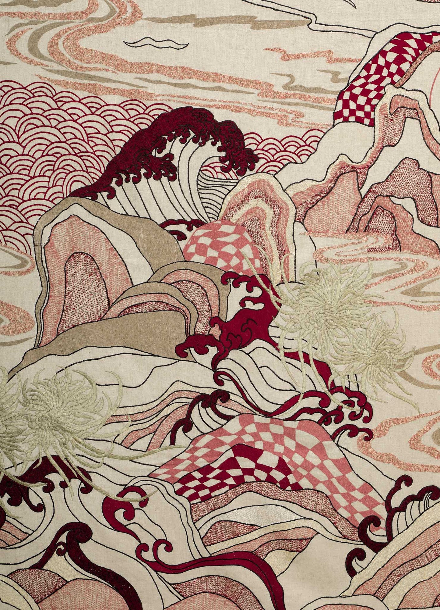 The Dreamscape Ecru Embroidered Bedcover by Viya showcases Japanese-style waves, mountains, and clouds in red, cream, and beige with symbolic motifs and intricate checkerboard and swirl patterns throughout.
