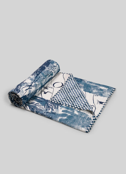 Rolled-up fabric with blue and white patterns on a gray background luxury cotton quilts viya