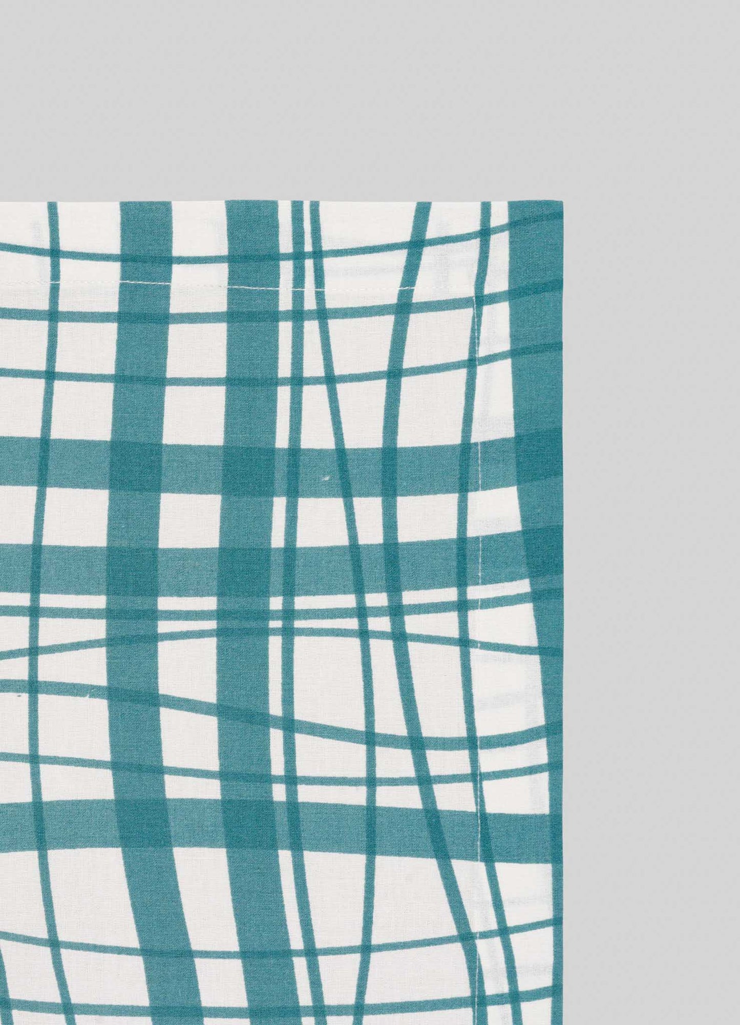 The Madras Check Aqua Napkins - Set of 4 by Viya feature teal and white madras checks with intersecting lines on a light gray background, ideal for adding a contemporary Indian-inspired touch to your collection.