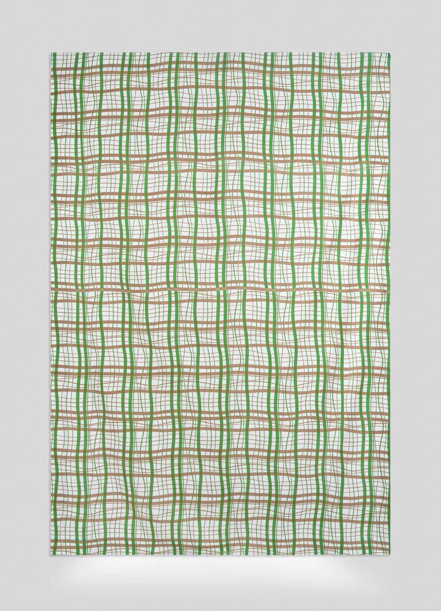 The Viya Madras Check Green & Beige Table Cloth features intersecting wavy green, brown, and orange lines on white, forming an abstract grid pattern reminiscent of madras checks with unevenly spaced lines for a modern look.