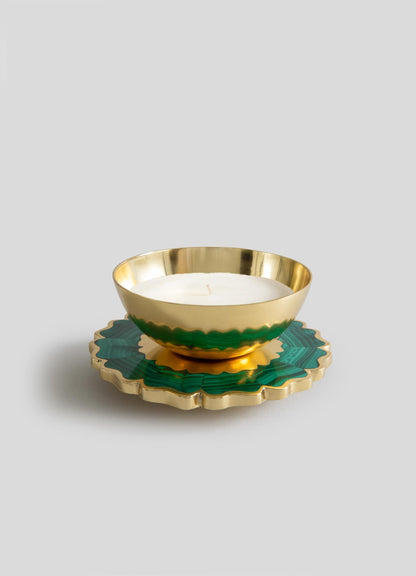 The Mystical Marigold Green - Scented Candle Diya Large by Viya features a gold bowl-shaped holder with a white candle on a scalloped green and gold base, beautifully crafted and set against a plain light gray background.