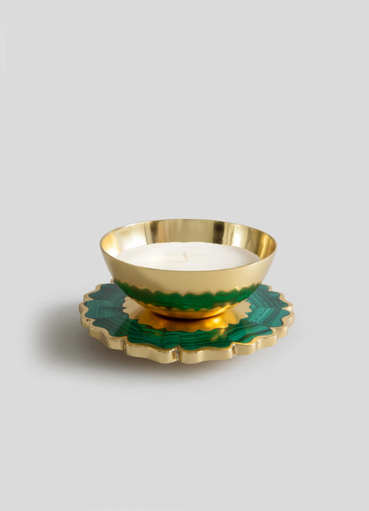 The Mystical Marigold Green - Scented Candle Diya Large by Viya features a gold bowl-shaped holder with a white candle on a scalloped green and gold base, beautifully crafted and set against a plain light gray background.