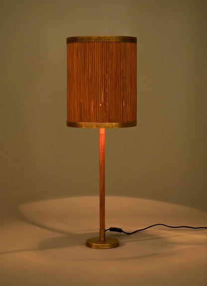 The VIYA Namsai Table Lamp Tall features a cylindrical design with a wooden base, brass accents, and a ribbed vertical-patterned shade that emits warm, soft light. A visible black power cord completes its elegant look.