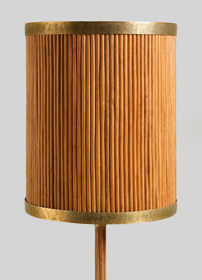 The VIYA Namsai Table Lamp Tall features a cylindrical shade with vertical wooden slats and textured brass borders on the top and bottom, set against a neutral background.