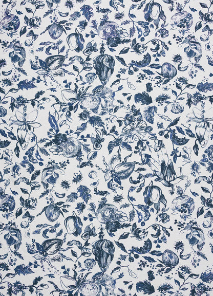 The Orchard Blue Table Cloth Large by Viya features a blue and white pattern with intricate floral and botanical designs, including wood apple and Indian pomegranate motifs inspired by Indian fruit orchards, evenly spread across the fabric.