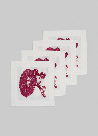 The Viya Orchard Red Cocktail Napkins, set of 4, feature a stylish Indian pomegranate and leaf design in one corner—perfect for adding an orchard-inspired touch to your table décor.
