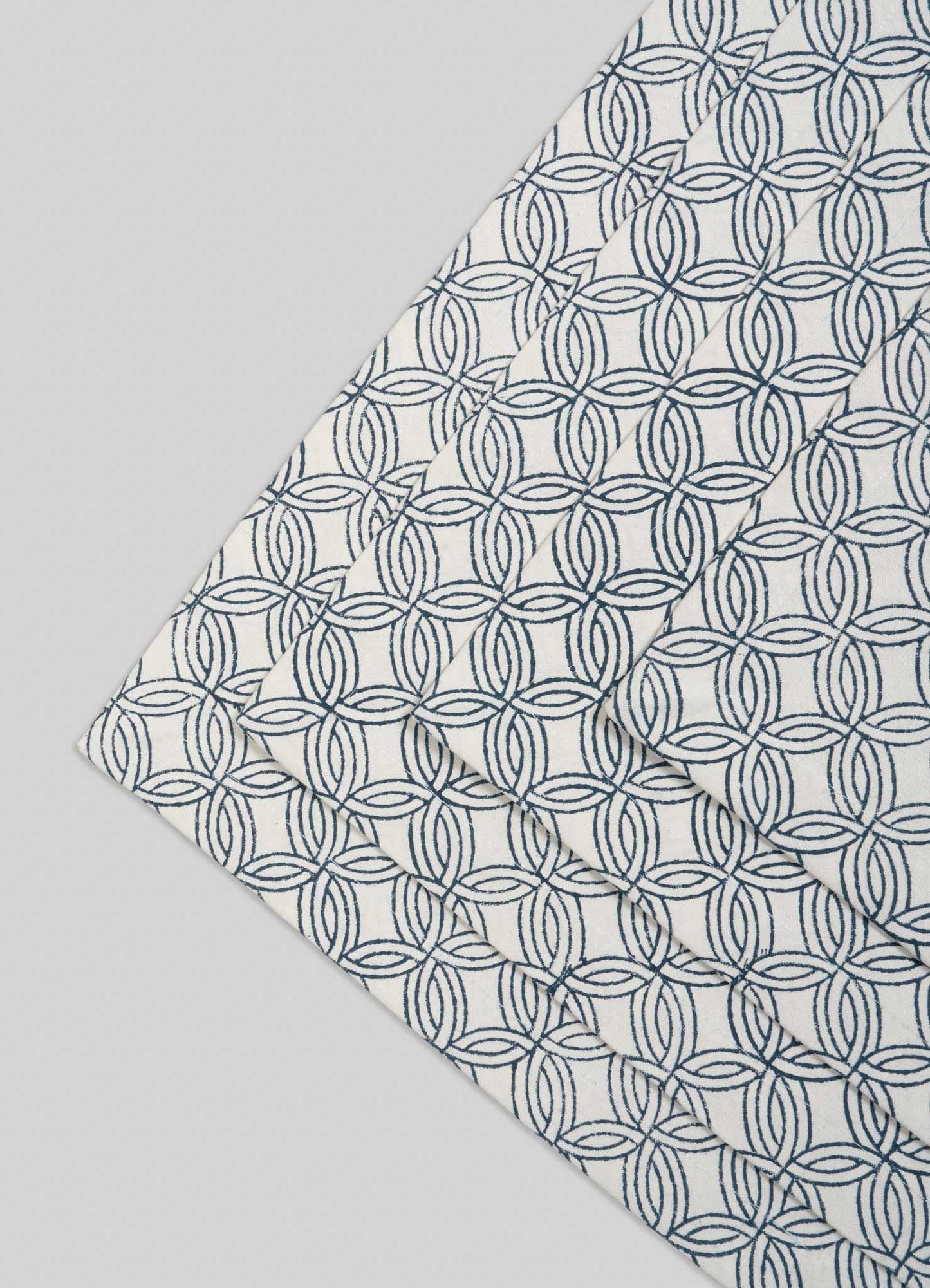 The Viya Paigah Navy Placemats (Set of 4) feature designs inspired by the intricate paigah jaalis of Hyderabad’s Indo-Islamic architecture.