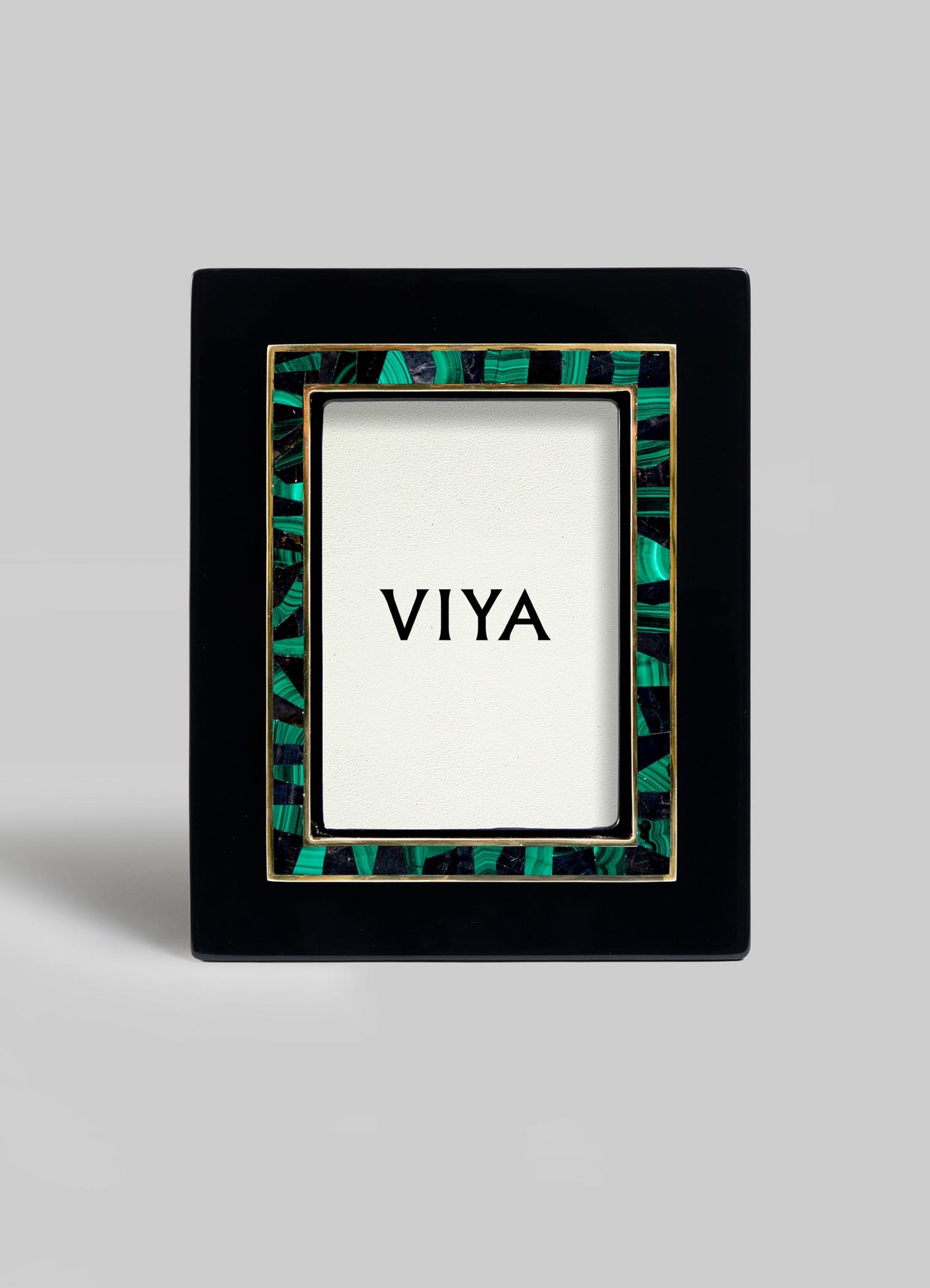 The VIYA Rivoli Photo Frame is a black rectangular frame with green and gold Art Deco accents, shown upright with a VIYA card at the center, evoking the vintage charm of old Bombay cinema halls.