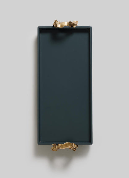 The VIYA Saffron Dark Blue Vanity Tray is rectangular with raised edges and two gold sculptural handles, set against a plain light gray background.