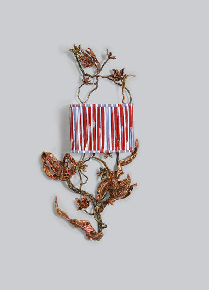 The Spring In Kashmir Wall Sconce B by VIYA features a small rectangular design with red, white, and blue stripes, surrounded by twisted brass and bronze branches—an eye-catching piece for unique home decor.