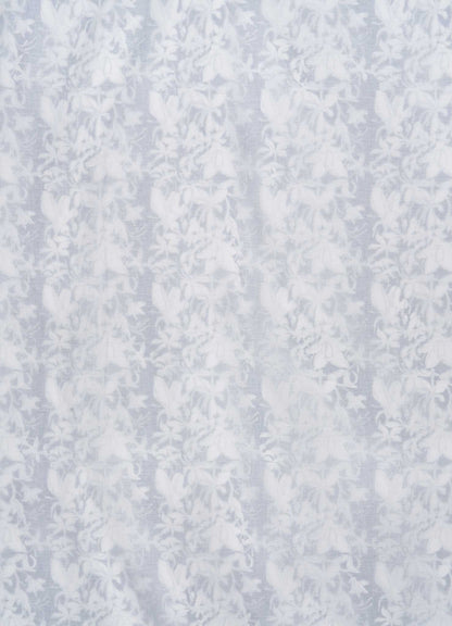 The Viya Spring Bouquet Blue Single Dohar features a delicate, translucent fabric with a vertical floral pattern of detailed leaves and flowers, evoking the elegance and texture of Indian garden bedding.