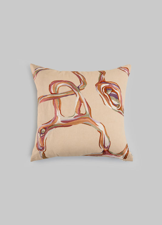 The Viya Tutti Frutti Salmon Pink Cushion Cover 18"x18" features a beige hand-embroidered abstract design in brown, pink, and purple, inspired by Cartier Tutti Frutti, shown against a plain light gray background.