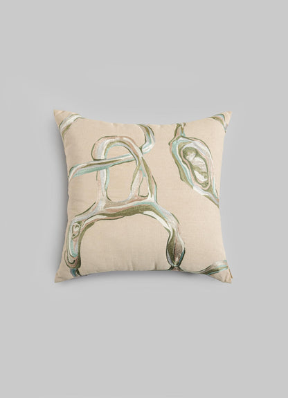 The Viya Tutti Frutti Sea Green Cushion Cover 18"x18" features an abstract green and brown pattern on beige, inspired by Cartier Tutti Frutti hand-embroidered designs, and is shown against a plain light gray background.